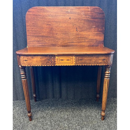 207 - 19th Century Flip top table, the D shaped surface above an inlaid frieze raised on turned tapered le... 