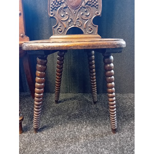 243 - Two 19th Century Oak Carved Hall Chairs with shield and foliate designs