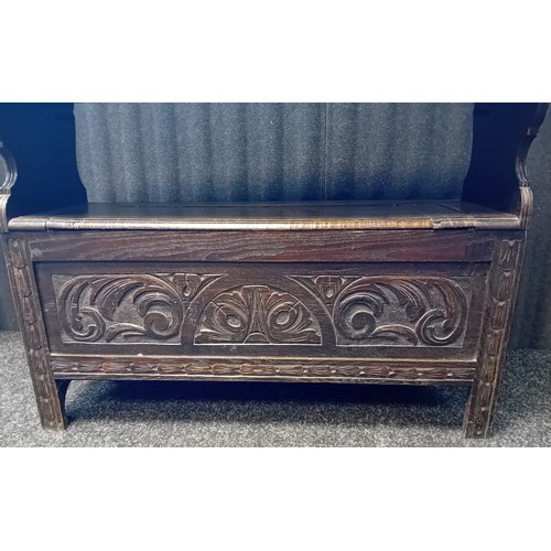 323 - Carved Oak Monks Bench with flip back 
[107x96x43cm]