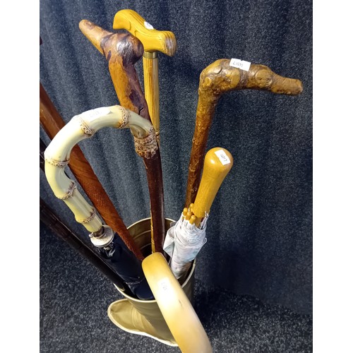 421 - Gold Tin Stick Stand filled with various walking sticks and umbrellas