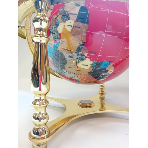 426 - Decorative Gemstone World Globe with Gold Four Leg Stand.
The Oceans are made of Lapis Lazuli, the C... 