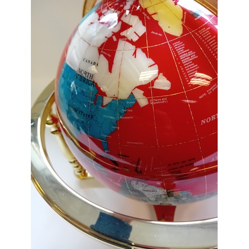 426 - Decorative Gemstone World Globe with Gold Four Leg Stand.
The Oceans are made of Lapis Lazuli, the C... 