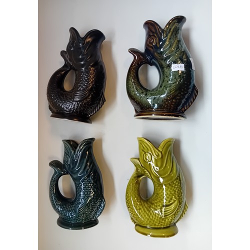 427 - Set of Four vintage Fosters Studio Pottery fish shaped gluggle Jugs