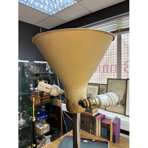 321 - An industrial design free standing up lighter together with a 20th century mahogany free standing la... 