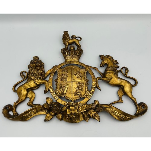51 - A 19th Century Royal Warrant gilt metal mount, Cast and pierced [30 x 21cm]