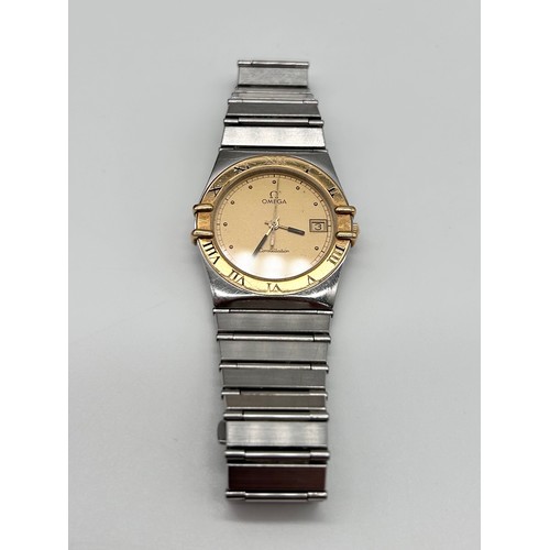 30 - OMEGA - a bi-metal Constellation quartz calendar bracelet watch circa 1991, champagne dial with dot ... 