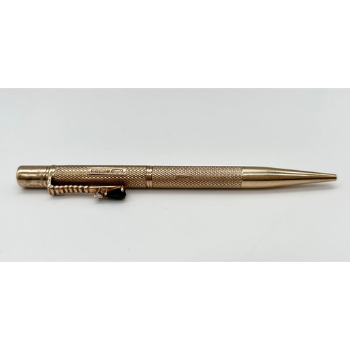 7 - 9ct gold revolving pen with sapphire and diamond detail (no magnet inside) [18.21g]
