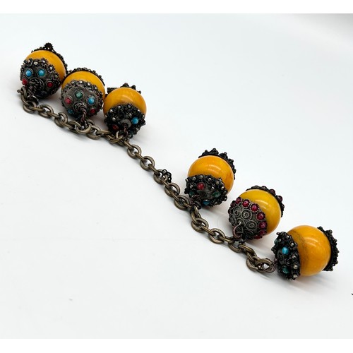 31 - Ethnic bracelet with egg yolk butterscotch amber beads [in need of attention]