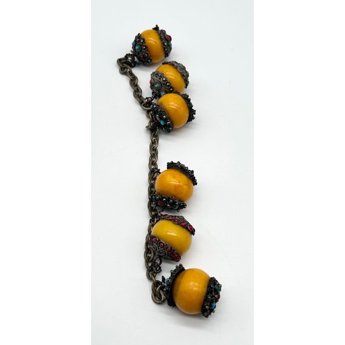 31 - Ethnic bracelet with egg yolk butterscotch amber beads [in need of attention]