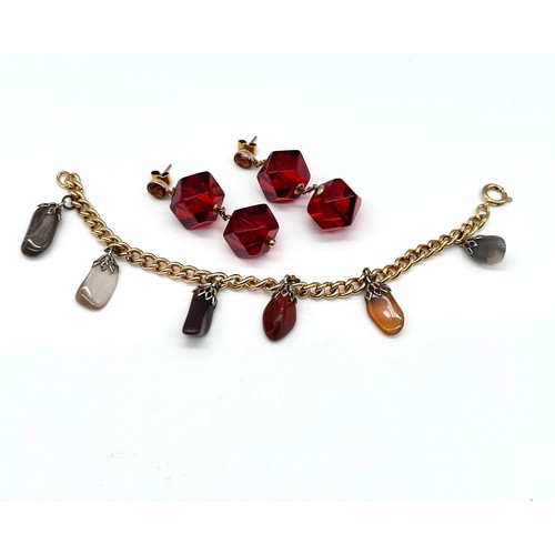 27 - A yellow metal curb link bracelet (unmarked) with six polished agate drops; with a pair of Amber col... 