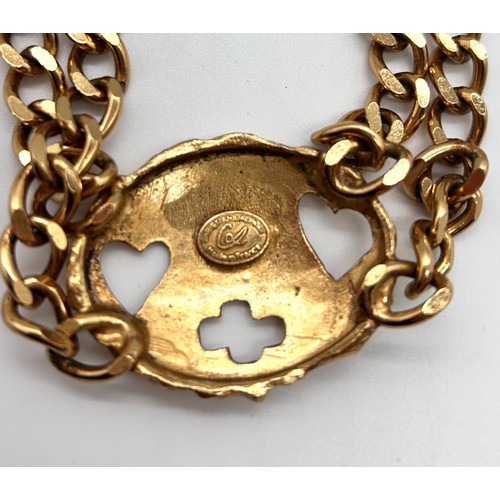 50 - Christian Lacroix gold tone necklace, cross pin brooch and two pairs of Christian Lacroix clip on ea... 