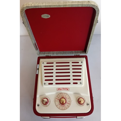 224 - 1950's Ever Ready Sky Baby portable valve radio together with a vintage Pye radio (model 1113- in wo... 