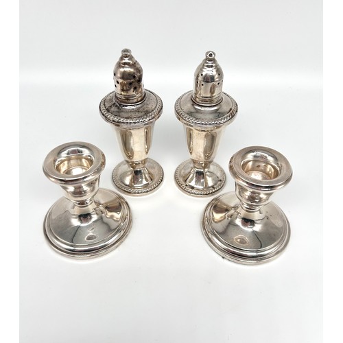 98 - Pair of Duchin Creations weighted silver salt and pepper shakers and a pair of filled silver candles... 