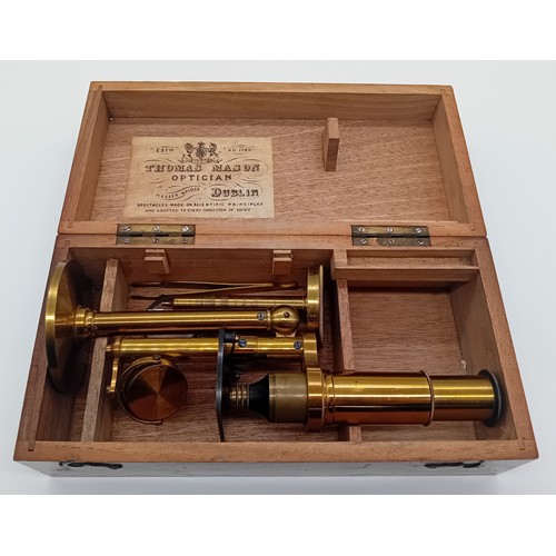 221 - Late 19th/Early 20th Century brass microscope by makers Thomas Mason Optician Dublin within a fixed ... 