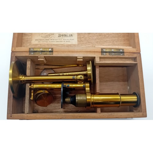 221 - Late 19th/Early 20th Century brass microscope by makers Thomas Mason Optician Dublin within a fixed ... 
