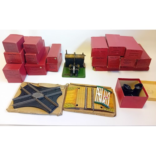 334 - Large collection of vintage Hornby Railway track, flat trunk, Brake vans, wagons, arm signal, locomo... 