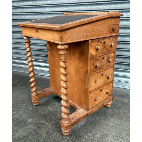 291 - 19th Century Maple davenport, the sloped leather surface opening to storage, flanked by banks of dra... 