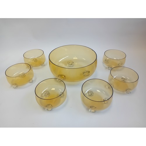 396 - Vintage amber glass footed bowl with six smaller