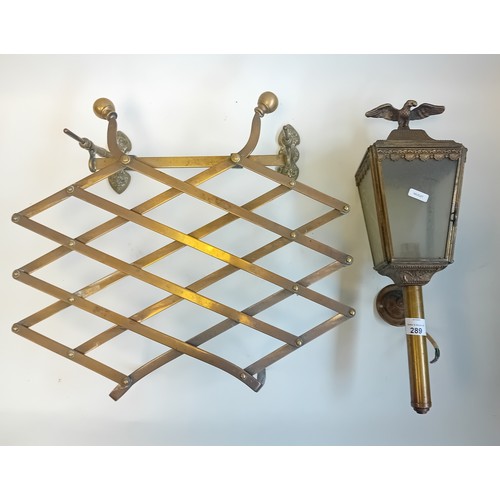 289 - Antique brass campaign folding portable trivet together with brass horse coach lamp featuring eagle ... 