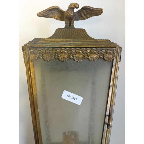 289 - Antique brass campaign folding portable trivet together with brass horse coach lamp featuring eagle ... 
