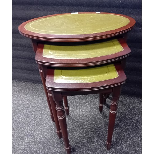 270 - Vintage nest of tables with green leather tops on turned legs