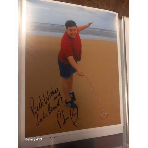 A folder of signed photos and pictures of tv personalities and film ...