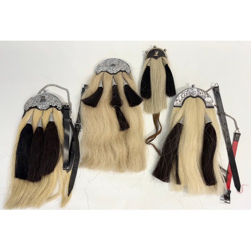 122 - Group of four sporrans