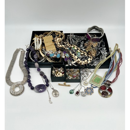 119 - Large collection of costume jewellery to include a box of ladies earrings, silver locket pendant and... 