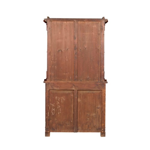 422 - Danish Mahogany bookcase on chest, the upper part with a pair of glazed doors enclosing shelves flan... 