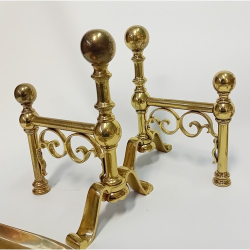 Collection of brass wares to include candlesticks, fire dogs and fire irons