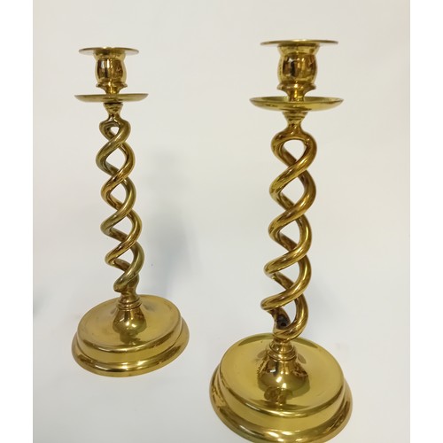 Collection of brass wares to include candlesticks, fire dogs and fire irons
