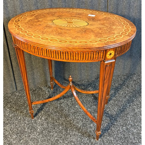 424 - A reproduction Burr walnut oval window table with parquetry design raised on squared tapered legs jo... 