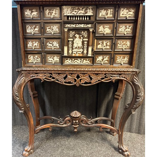 423 - 17th century, Rosewood cabinet on later stand, of eight drawers & cupboards enclosing small drawers ... 