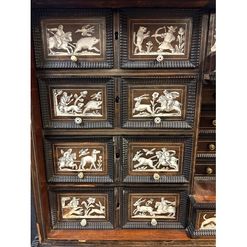423 - 17th century, Rosewood cabinet on later stand, of eight drawers & cupboards enclosing small drawers ... 