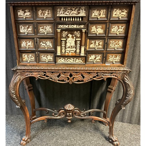 423 - 17th century, Rosewood cabinet on later stand, of eight drawers & cupboards enclosing small drawers ... 