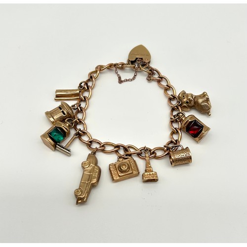 18 - 9ct Gold Charm Bracelet with 10 Charms 
Weight - 29.42g