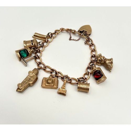 18 - 9ct Gold Charm Bracelet with 10 Charms 
Weight - 29.42g