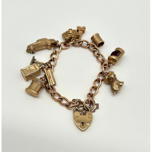 18 - 9ct Gold Charm Bracelet with 10 Charms 
Weight - 29.42g