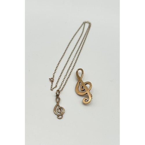 28 - 9ct Gold Treble Clef Brooch with 9ct Necklace and Pendant 
Weight - 5.61g
