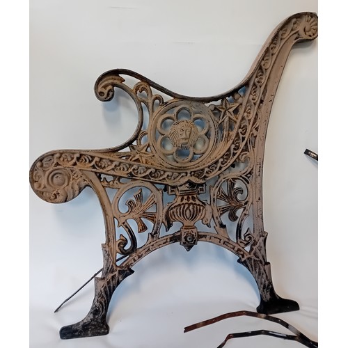 354 - Pair of Victorian salvage cast iron bench ends featuring lion heads and ornate scrollwork design