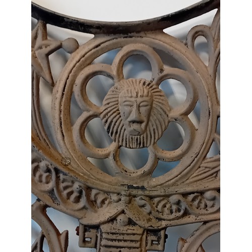 354 - Pair of Victorian salvage cast iron bench ends featuring lion heads and ornate scrollwork design