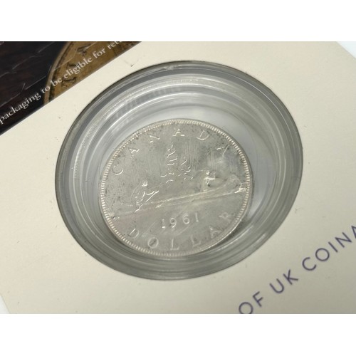 54 - The Royal Mint Collector Services a Genuine Historic Coin 1961 Silver Canada Dollar, featuring the f... 