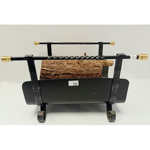 Black metal framed log holder with brass detail