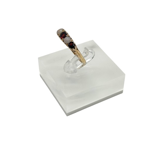 47 - 9ct Yellow Gold with round-cut Garnets and opal stones. 
Size - N
Weight - 2.42g