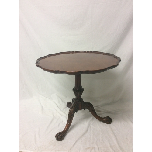 146 - American three legged table with pie crust edged.