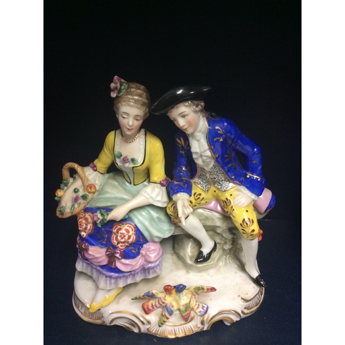 186 - A Victorian Chelsea porcelain figure group. Gold anchor mark.