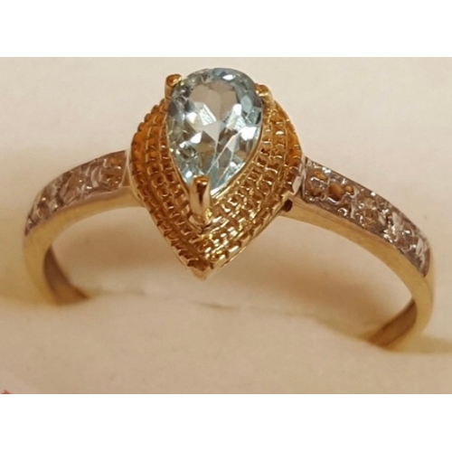 149 - 9ct Gold Swiss blue topaz & diamond pear setting ring.