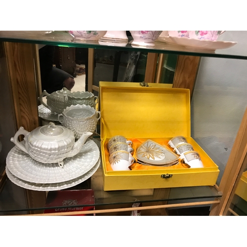 238 - Boxed part tea set, shell tea pot s and cream jug.