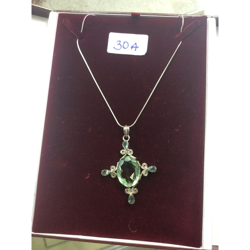 30a - silver hall marked chain and pendant with large green stone.