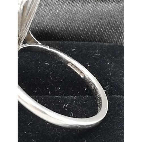 375 - Large white gold opal and diamond ring.